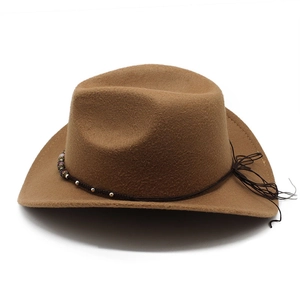 Detail of brown wool cowboy hat with beaded woven cord and western fringe accents