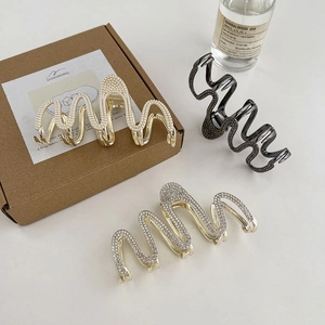 Large wavy shark hair clips with pearls and rhinestones in gold, silver and grey finishes