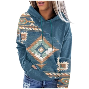 Close-up of vintage geometric pattern and soft brushed fabric on teal hoodie for women