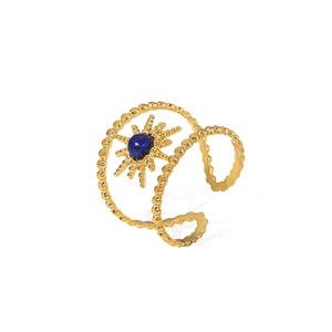 Golden double-row starburst ring with a blue semi-precious stone on white background