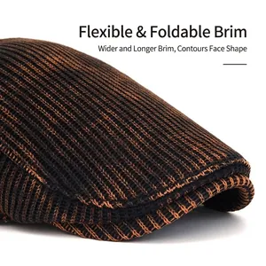 Knitted newsboy hat with wide bendable brim and warm tie-dye wool texture in brown