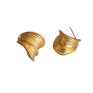 Minimalist matte gold C-shape stud earrings with textured vertical ridges and metal finish