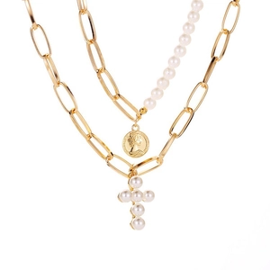 Layered gold necklace with pearl coin and cross pendant for elegant vintage styling