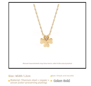 Detail of clover heart pendant in gold finish with sparkling cubic zirconia stones