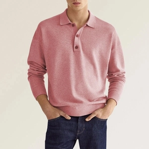 Detail of pink long-sleeved polo sweater showing knitted texture and buttoned V-neckline