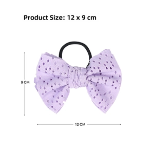 Detail showing lilac eyelet lace bow hair tie dimensions of 12cm by 9cm with elastic band