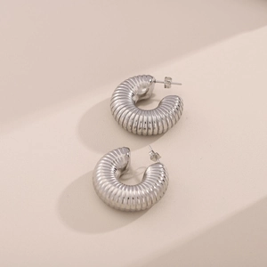 Sleek silver hollow spiral hoop earrings in stainless steel with a high-polish finish