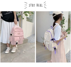 Dual view of pink and beige nylon school backpacks showing hand-carry and shoulder modes