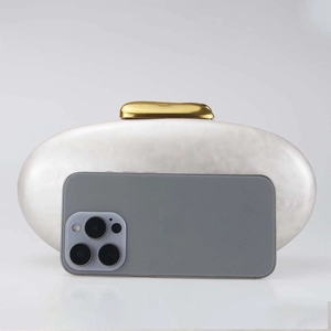 Chic off-white acrylic shell evening clutch with gold clasp and pearl finish