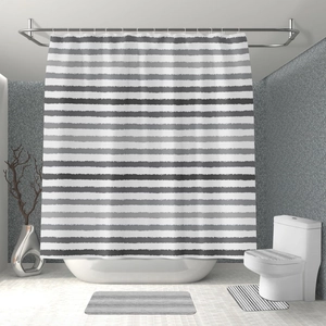 Modern black and white striped shower curtain with matching non-slip bath mats and lid cover