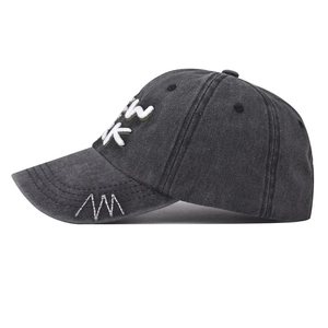 Close-up of New York 3D embroidery and vintage washed cotton detail on baseball cap