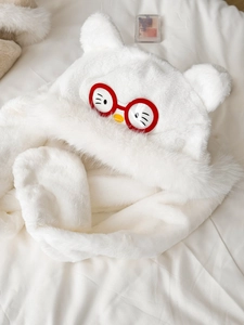 Macro detail of white plush three-in-one scarf hat with cute cartoon bear ears and face