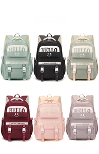 Detailed grid view of six colored nylon school backpacks with buckle flap and HELLO print