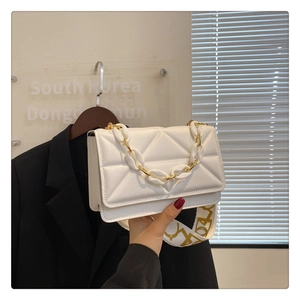 White geometric quilted flap bag with stylish resin chain and wide graffiti strap