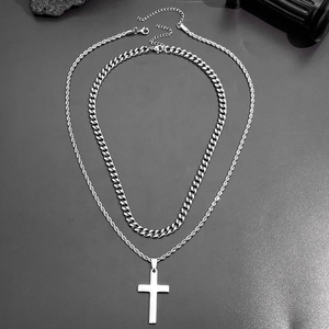 Double-layered stainless steel necklace featuring a Cuban chain and a cross pendant set