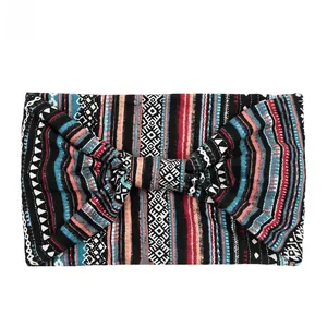 Macro view of bohemian wide knotted headband with ethnic geometric patterns