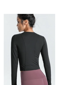 Haut de sport noir à manches longues avec coutures ergonomiques pour yoga et fitness