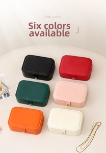 Macro view of portable leather jewelry boxes in six colors with metal snap buttons