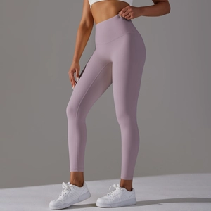Detail view of high-waist lavender yoga pants featuring seamless stretch and body-sculpting fit