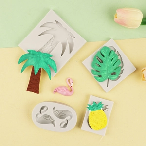 Tropical silicone molds featuring flamingo, palm leaf, pineapple, and coconut tree shapes