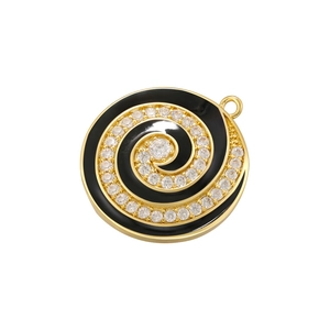 Macro shot of gold-plated spiral pendant with black enamel and sparkling crystal inlay