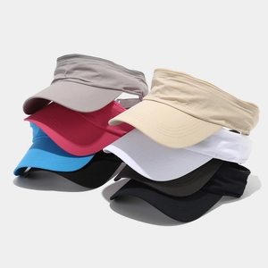 Selection of quick-dry sun visors in various colors like grey, beige, and pink for sports