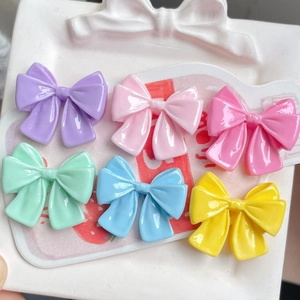 Set of 6 colorful resin bowknot charms in vibrant candy colors for DIY accessories