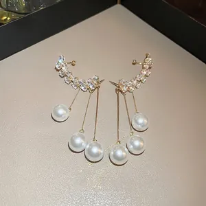 Elegant gold curved ear cuffs with sparkling crystals and long pearl tassels for women