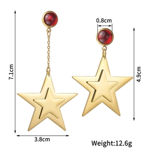Star-shaped gold titanium earrings with red ruby inlay and asymmetric long chain design