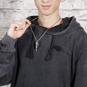 Men's stainless steel silver bullet pendant necklace with dragon carving worn by model