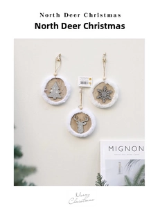 Detailed view of round wooden Christmas ornaments with silver deer and snowflake patterns