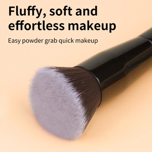 Detail of bicolored fiber bristles on a black makeup brush for soft application