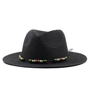 Close-up of the black straw fedora featuring a colorful ethnic style beaded band