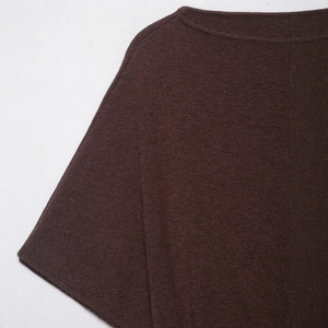 Minimalist dark brown boat neck knit top with fine texture and elegant shoulder detail