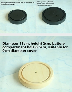 Detail view of 11cm round display base in matte black and wood for flower domes