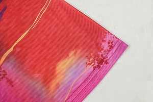 Close-up of breathable mesh fabric detail featuring a vintage red and pink floral print