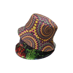 Detailed view of stacked bucket hats with psychedelic wave and graffiti patterns.