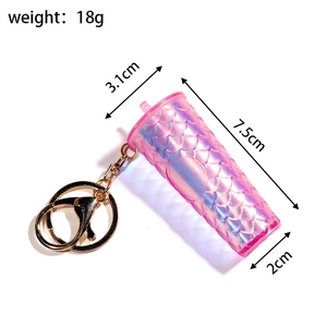Pink keychain with fish scale texture and measurements: 7.5cm length and 18g weight