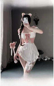 Detail view of pink maid cosplay outfit with lace apron, cat ears and bow tie