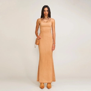 Slim fit brown adjustable strap maxi dress styled with a matching crossbody bag and boots