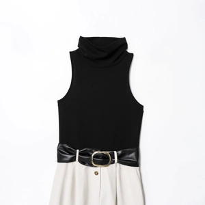 Sleeveless high-neck dress in black and white contrast with a belted faux leather waist