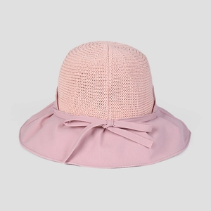 Detail of pink summer sun hat showing breathable knit crown and elegant bow decoration
