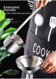 Detail of 250ml 304 stainless steel ladle pouring liquid into a kitchen funnel