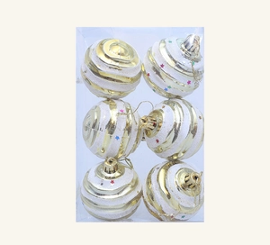 Detail view of 6-pack gold and white striped Christmas ornaments with star patterns