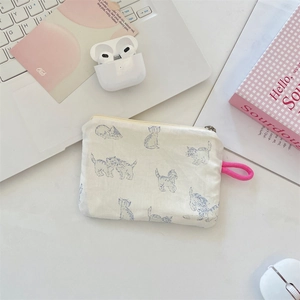 Close-up of cream floral coin purse with cat print and pink woven lanyard