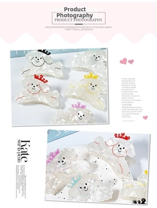 Detailed macro view of 5 cute poodle claw clips with colorful crowns and pearl luster