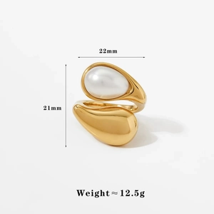 Detailed view of golden metal open ring with large white pearl and size specifications
