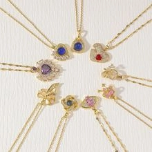 Detail of gold pendants with colorful heart and star zircons in anime inspired designs