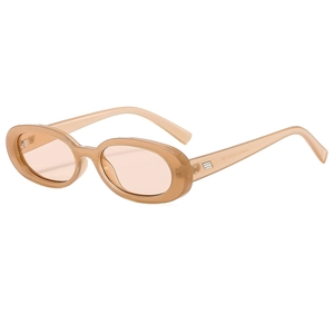 Retro oval sunglasses with translucent champagne frames and soft pink tinted lenses