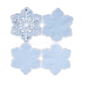 Detail of light blue snowflake napkins with silver foil patterns for Christmas party decor